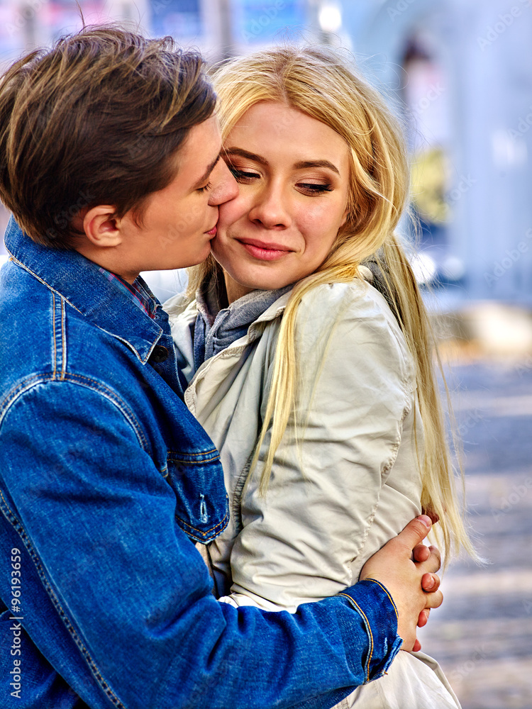 Fototapeta premium Young couple hugging and flirting in park.