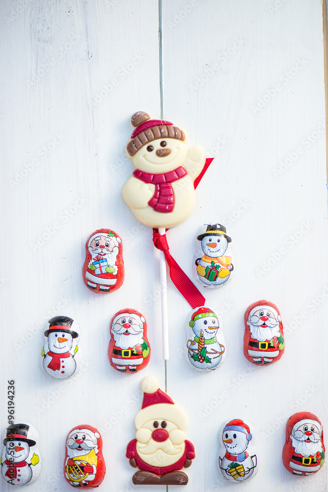 Chocolate Santas, Snowman and Biscuits laying in a form of Chris Chocolate Santas, Snowman and Biscuits laying in a form of Chris