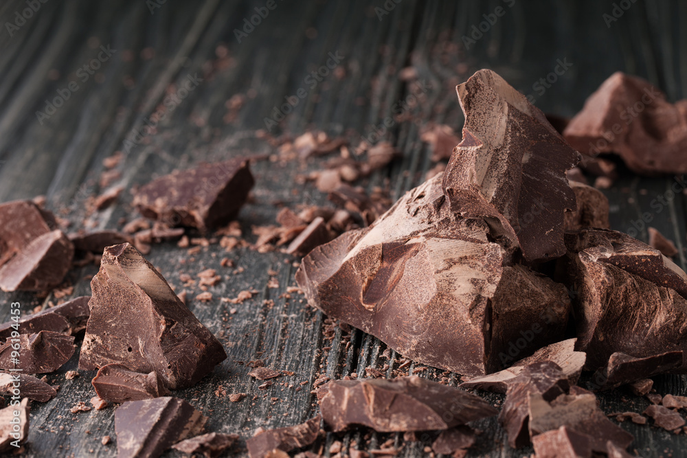 Chocolate pieces on a dark backround Chocolate pieces on a dark backround