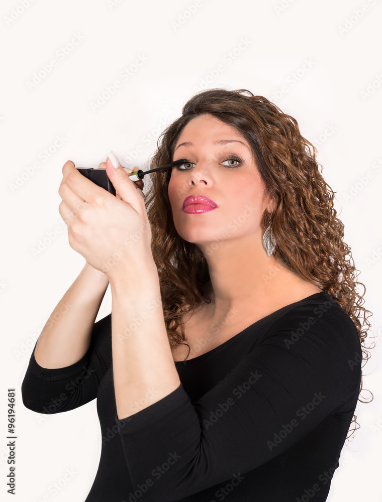 Obraz premium pretty woman applying makeup