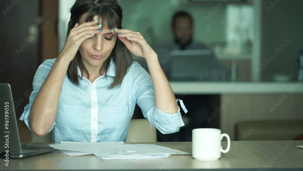 Overwhelmed, shocked businesswoman with documents sitting by table in office
Overwhelmed, shocked businesswoman with documents sitting by table in office