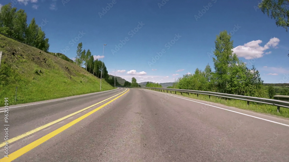 Driving a Car on a Road in Norway Driving a Car on a Road in Norway