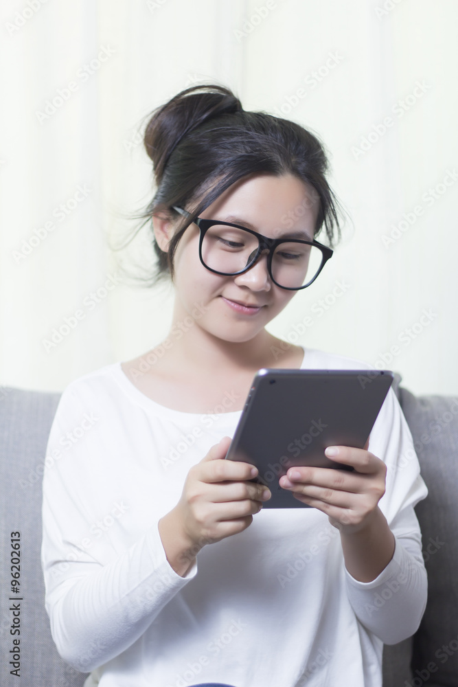 Woman use Tablet and Happy