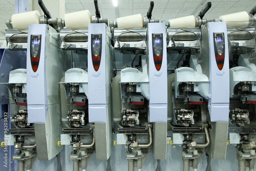 Spinning mill equipment is running, close-up Spinning mill equipment is running, close-up