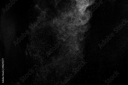 abstract white dust explosion  on a black background. abstract white powder. design elements. abstract texture. photo