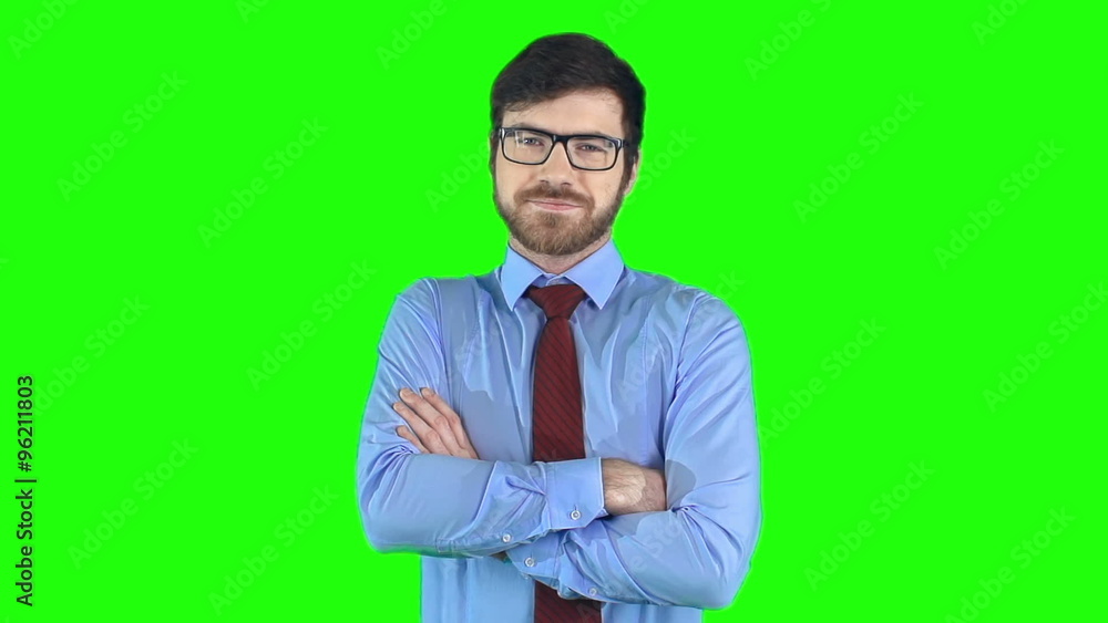 Medium shot of young confident businessman crossing his arms Medium shot of young confident businessman crossing his arms