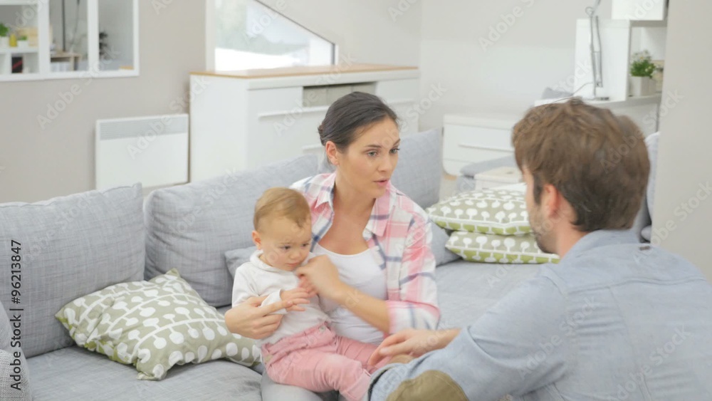 Man and woman arguing in front of baby Man and woman arguing in front of baby