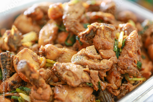 Sauteed spicy chicken with herb, close up