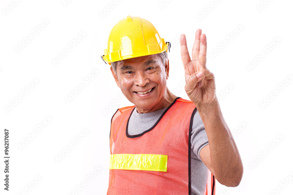 happy, smiling construction worker pointing up 3 fingers gesture