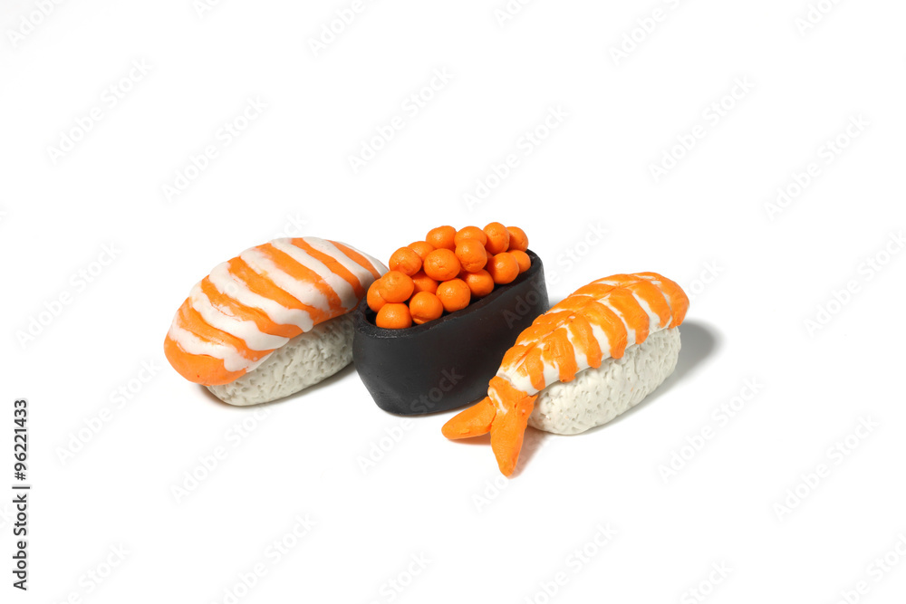 Naklejka premium miniature sushi model from japanese clay on white background