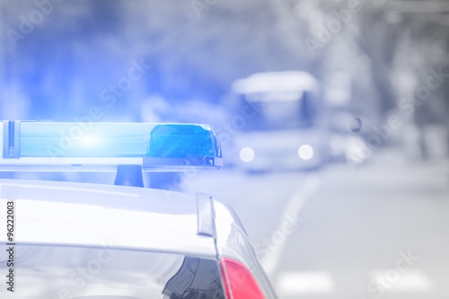 Fotografija Police car with lights turned on.