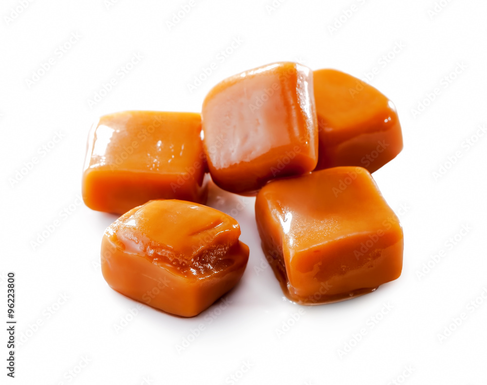 melted toffee caramel candy close-up isolated on white background melted toffee caramel candy close-up isolated on white background