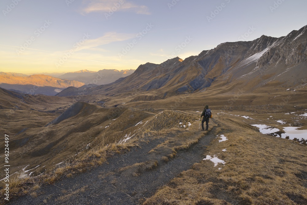 hiker with backpacking observes the Alps, Savoy, France