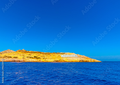 the Greek flag painted on the ground of Pserimos island in Greece photo