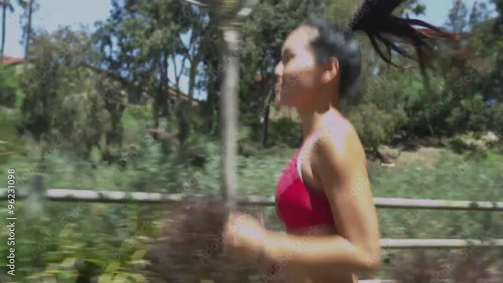 Asian woman running at the park Asian woman running at the park