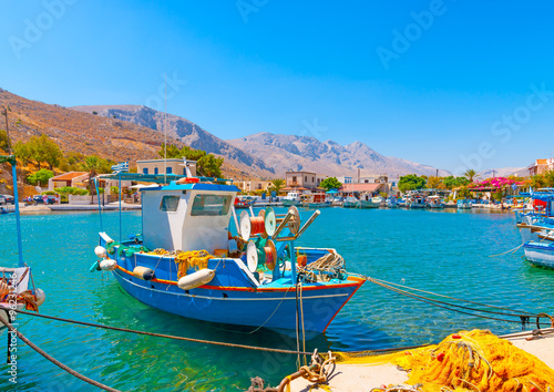 traditional fishing boats  docked at the port of Vathi village in Kalymnos island in Greece photo