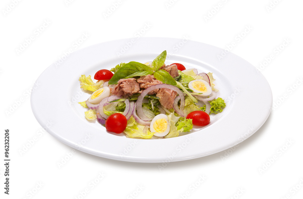 tuna with quail egg tomato and lettuce on a white background