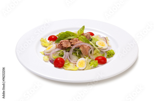 tuna with quail egg tomato and lettuce on a white background