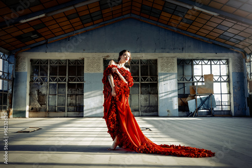 Woman wearing a red dress © smmartynenko