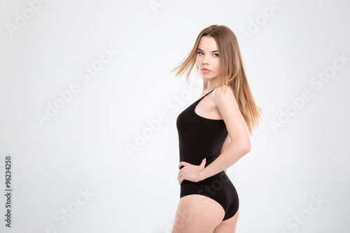 Attractive young woman turning around and looking at you