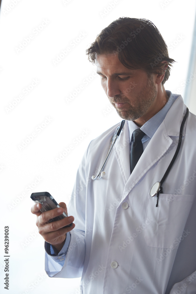 doctor speaking on cellphone