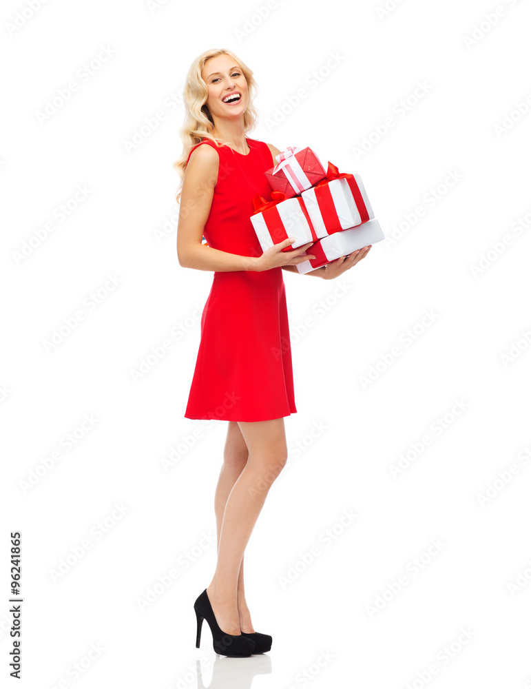 happy young woman in red dress holding gift boxes happy young woman in red dress holding gift boxes