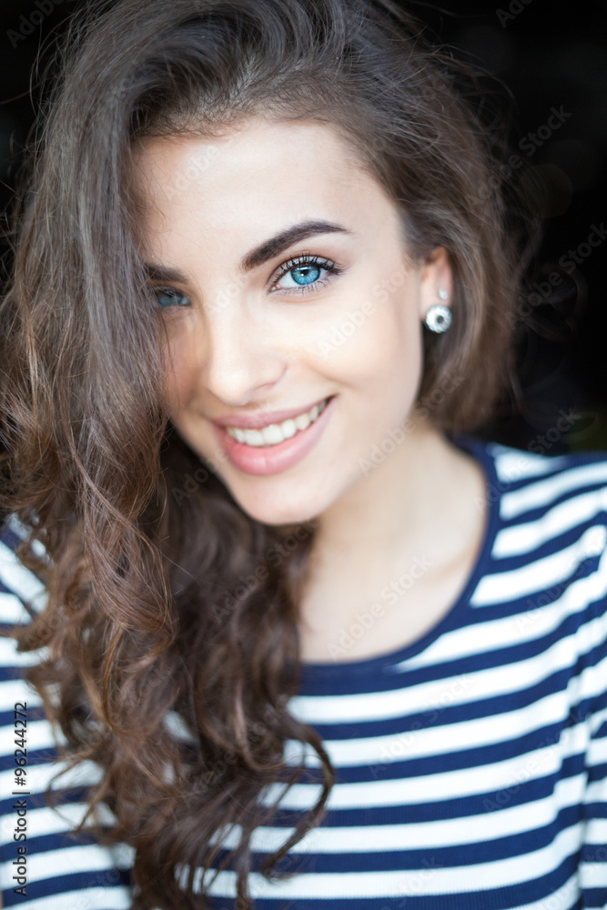 Close up portrait of beautiful smiling young woman