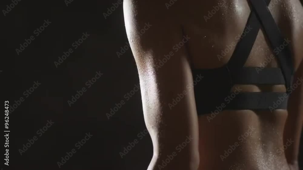 Active Asian woman lifting dumbbells weights and sweating Active Asian woman lifting dumbbells weights and sweating