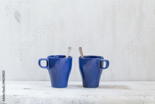 mugs and forks on table © vlntn