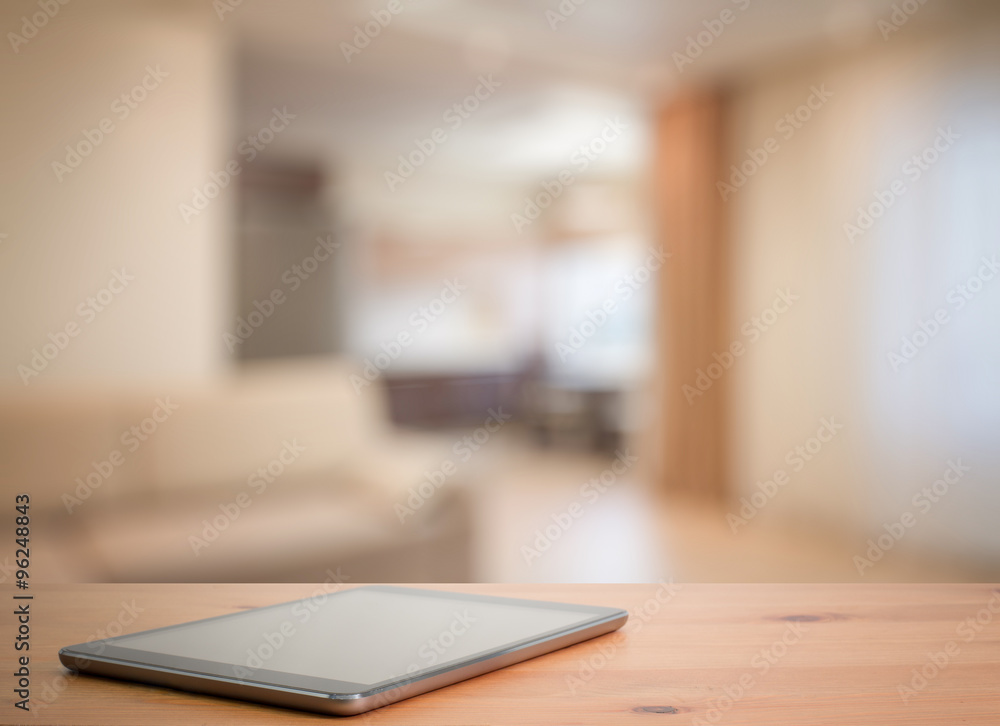 tablet on wooden table tablet on wooden table