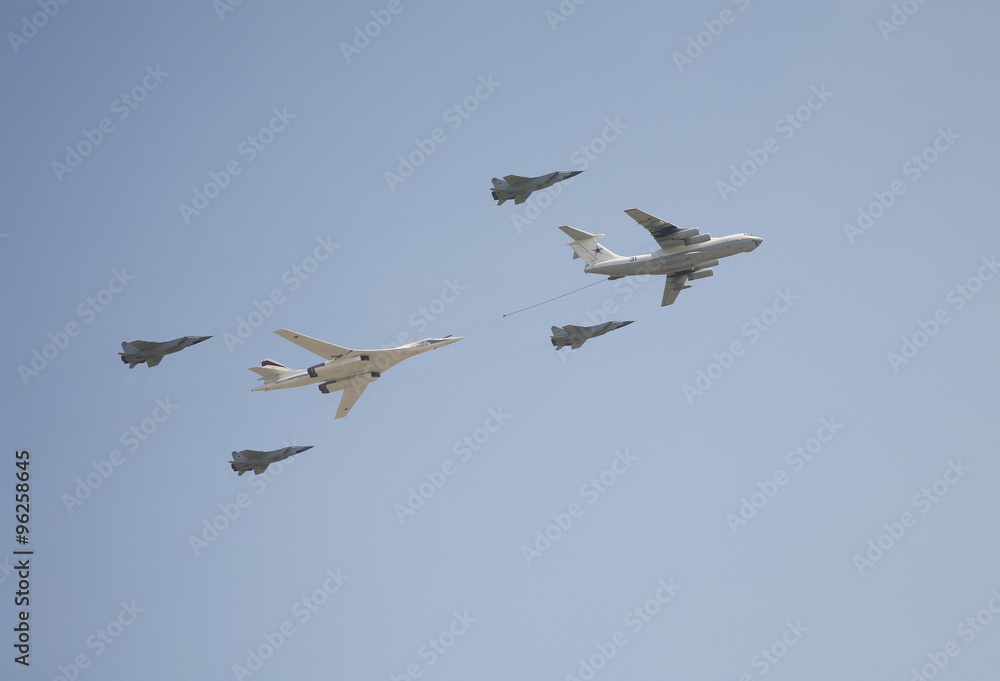 The span of the supersonic strategic bomber-rocket carrier TU-160 White Swan (Blackjack), tanker aircraft Il-78 and Mig-29 jet fighters at the parade devoted to 65th anniversary of Victory Day The span of the supersonic strategic bomber-rocket carrier TU-160 White Swan (Blackjack), tanker aircraft Il-78 and Mig-29 jet fighters at the parade devoted to 65th anniversary of Victory Day