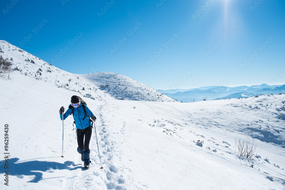 Girl walking on snowy mountains