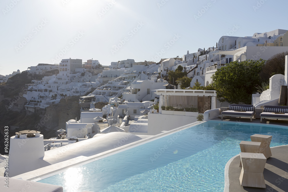 Obraz premium Luxury resort swimming pool in Santorini, Greece