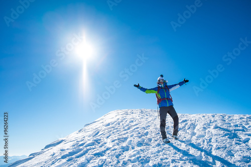 smiling woman on a snowy mountain