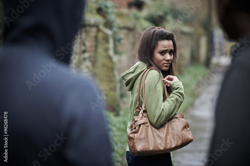 Teenage Girl Feeling Intimidated As She Walks Home photo