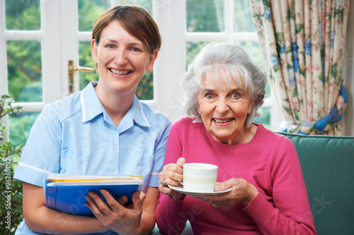 Senior Woman With Carer At Home