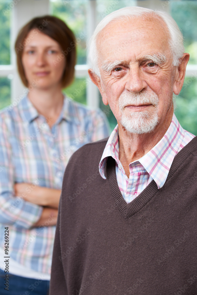 Serious Senior Man With Adult Daughter At Home Serious Senior Man With Adult Daughter At Home