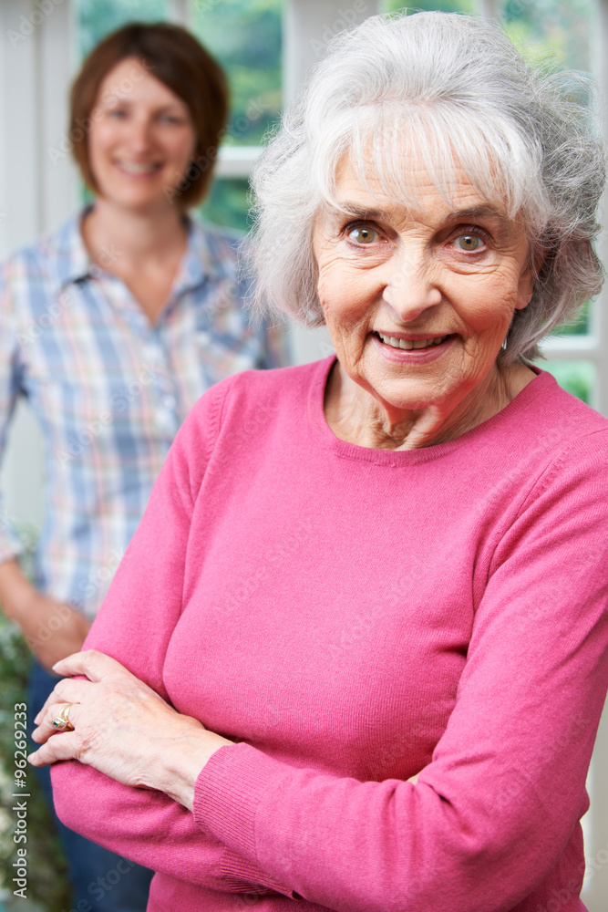 Senior Woman With Adult Daughter At Home Senior Woman With Adult Daughter At Home