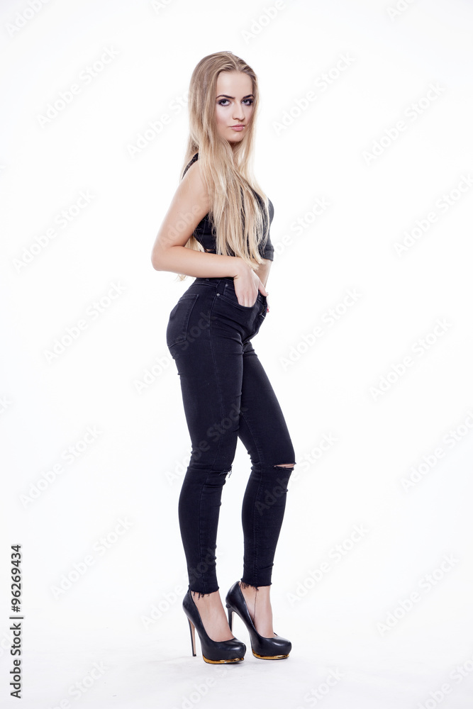 Young slim sexy woman in black dress isolated on white backgroun Young slim sexy woman in black dress isolated on white backgroun