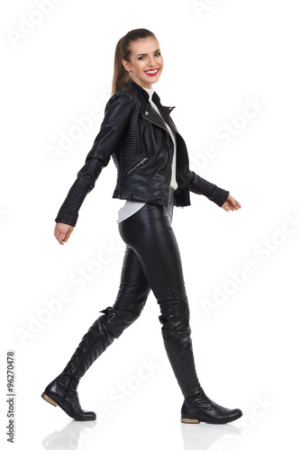 Smiling Girl Walking In Leather Clothes