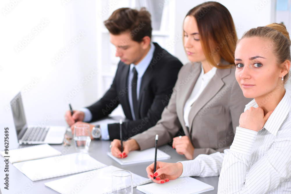 Group of Business people at meeting, focus on blond business woman Group of Business people at meeting, focus on blond business woman