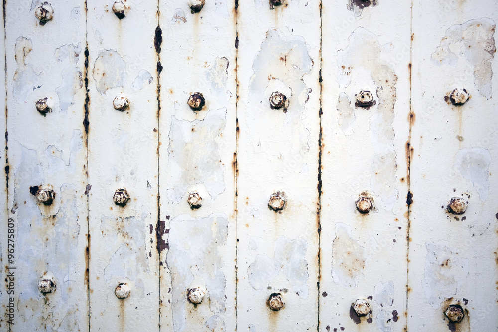 Fototapeta premium Rusty metal wall with bolts