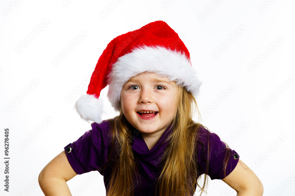 Cute little preschooler girl in red santa hat with gift box Cute little preschooler girl in red santa hat with gift box