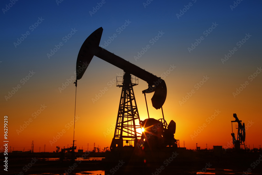 In the evening, the silhouette of the oil pump In the evening, the silhouette of the oil pump