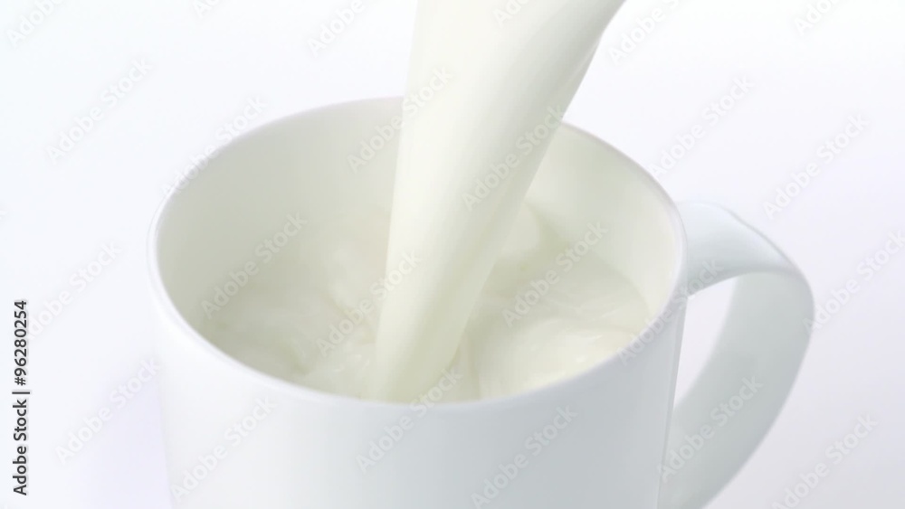 Pouring milk into mug shooting with high speed camera. Pouring milk into mug shooting with high speed camera.