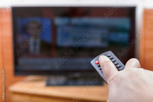 Tableau sur toile turn off News on TV channel by remote control