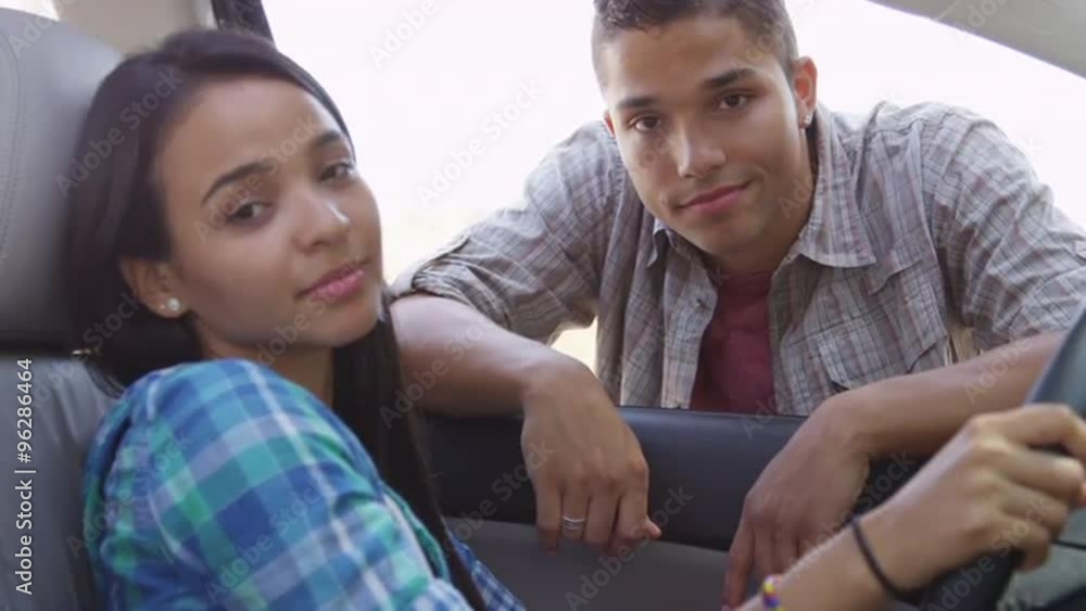 Hispanic couple smiling at camera Hispanic couple smiling at camera