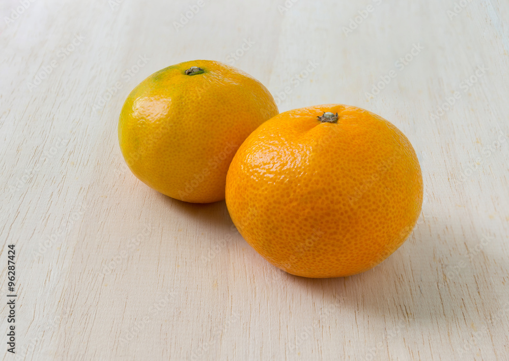 Orange on the white wood Orange on the white wood