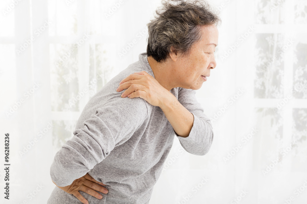 senior woman suffering in shoulder pain senior woman suffering in shoulder pain