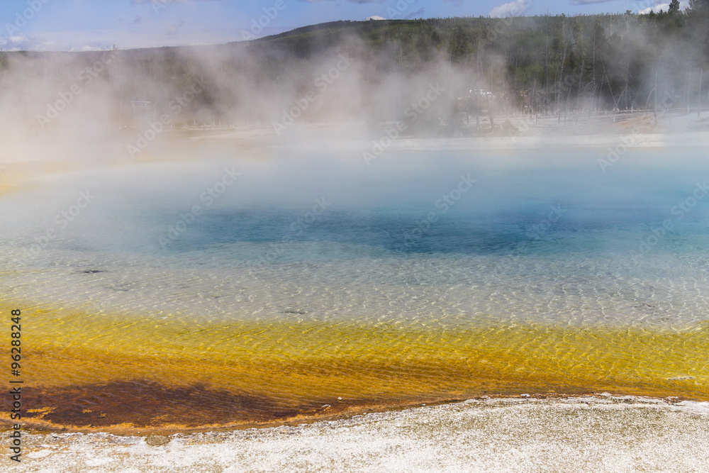 Colorful clear pool in Yellowstone Colorful clear pool in Yellowstone